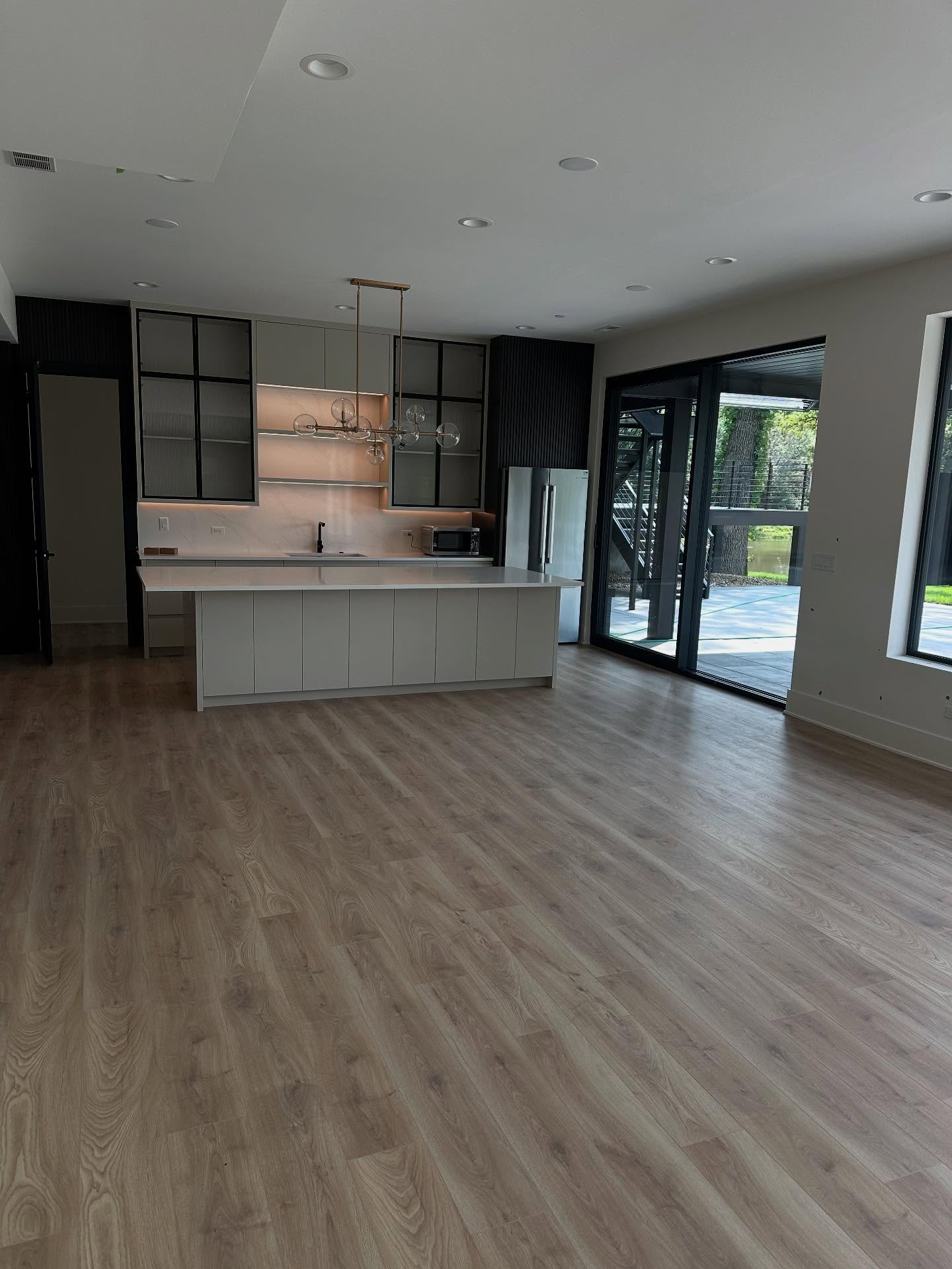 Modern open kitchen with glass cabinets in Oak Brook custom build