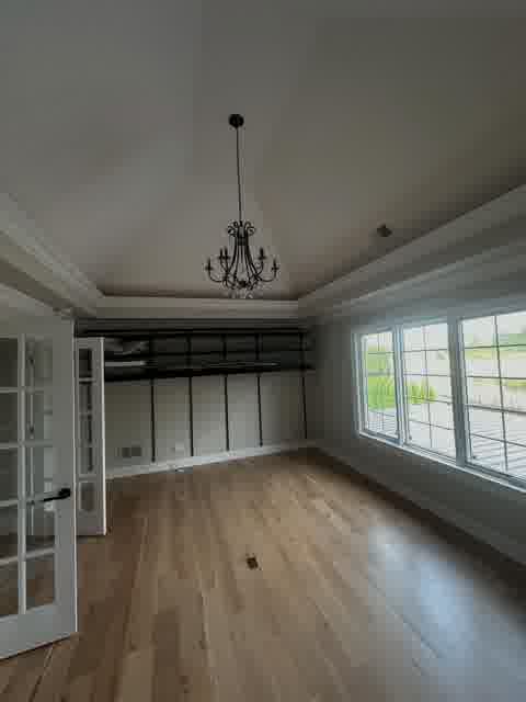 Vaulted bedroom with chandelier in Bloomingdale