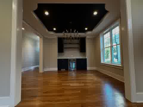 Elegant dining room with tray ceiling in Elmhurst