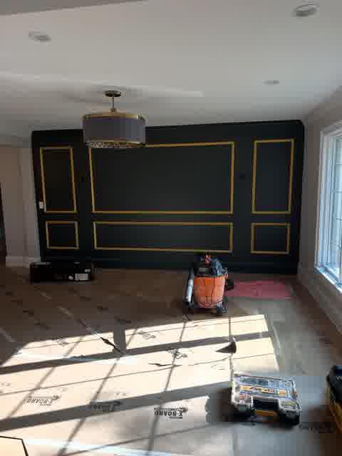 Navy accent wall with gold trim molding, Bloomingdale