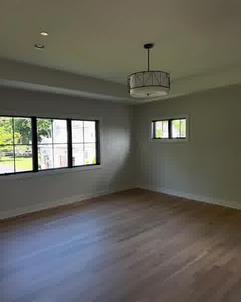 Master bedroom with tray ceiling, drum chandelier and hardwood floors, Clarendon Hills