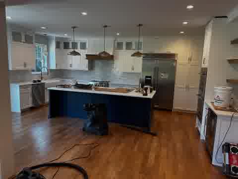 Kitchen with blue island and white cabinetry, Elmhurst