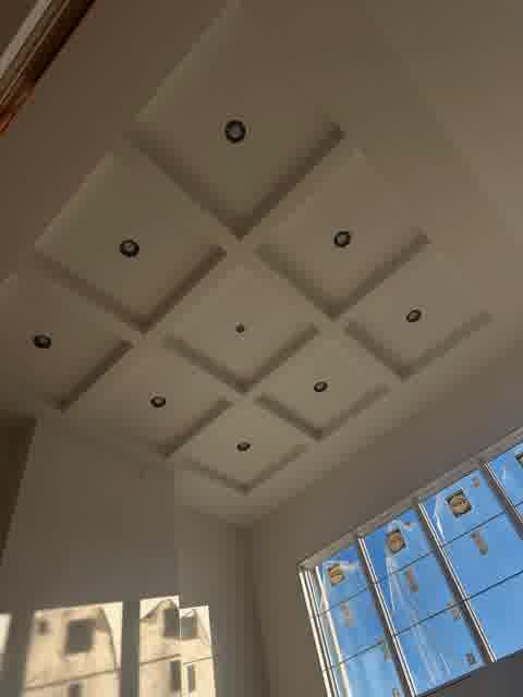 Coffered ceiling drywall with recessed lights and massive windows, near completion, Lombard