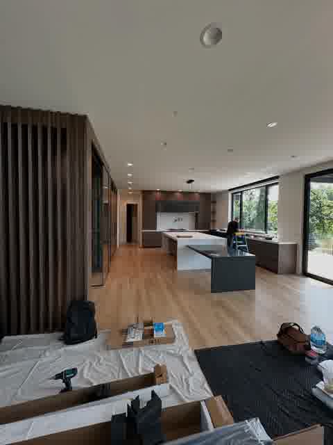 Open concept kitchen with walnut slat divider and waterfall island, Oak Brook
